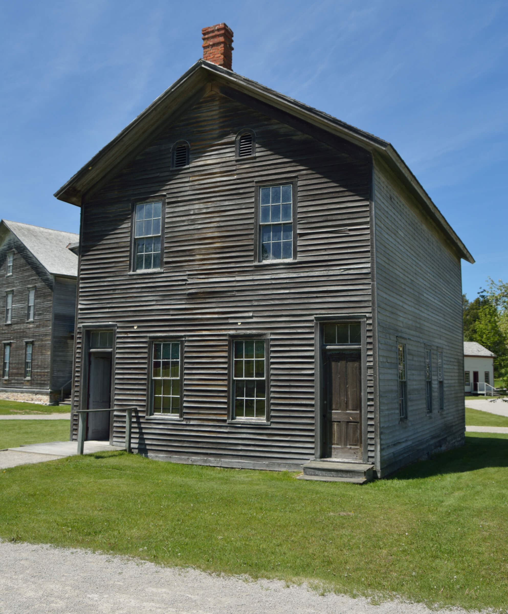 A restored wooden building with weathered siding in Fayette State Park.