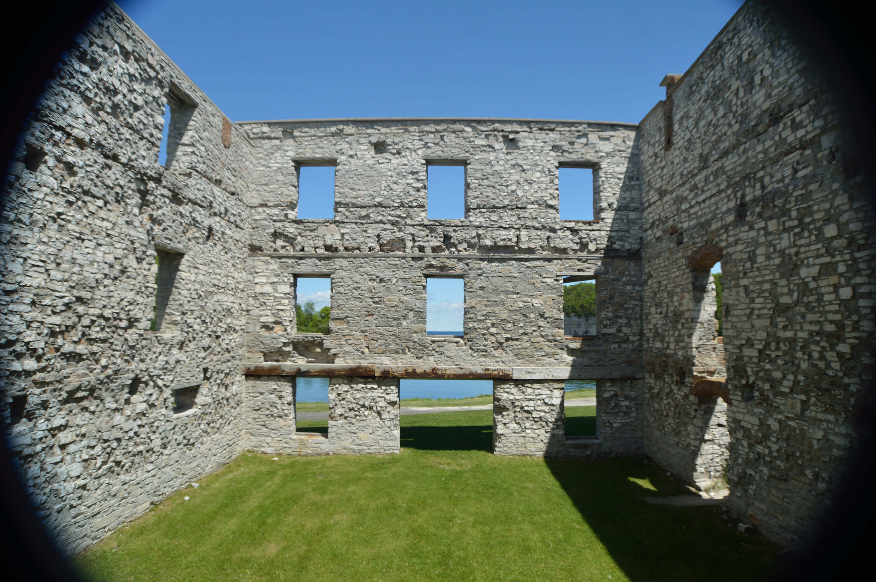 Stone walls of the Fayette furnace ruins with open window frames.