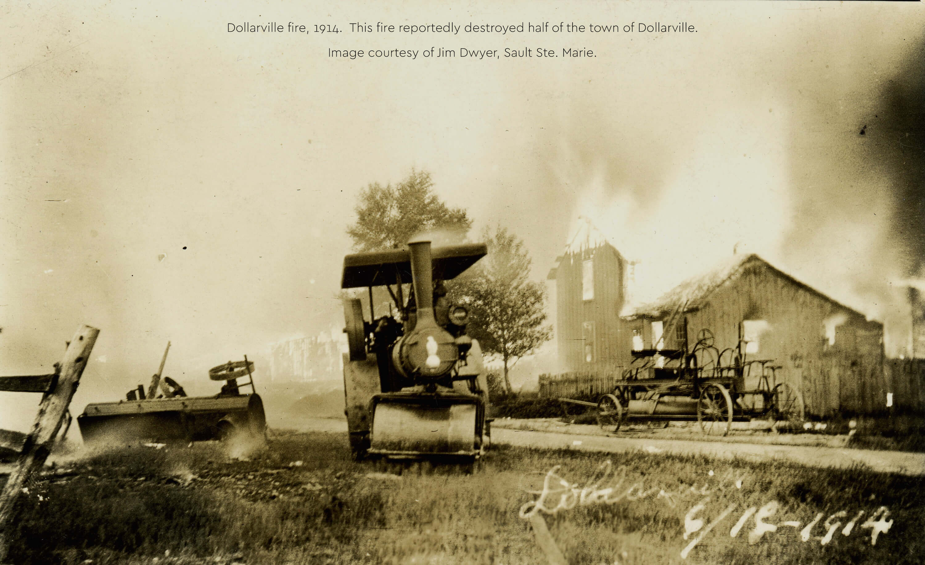 Historical photo of the 1914 Dollarville fire destroying buildings.