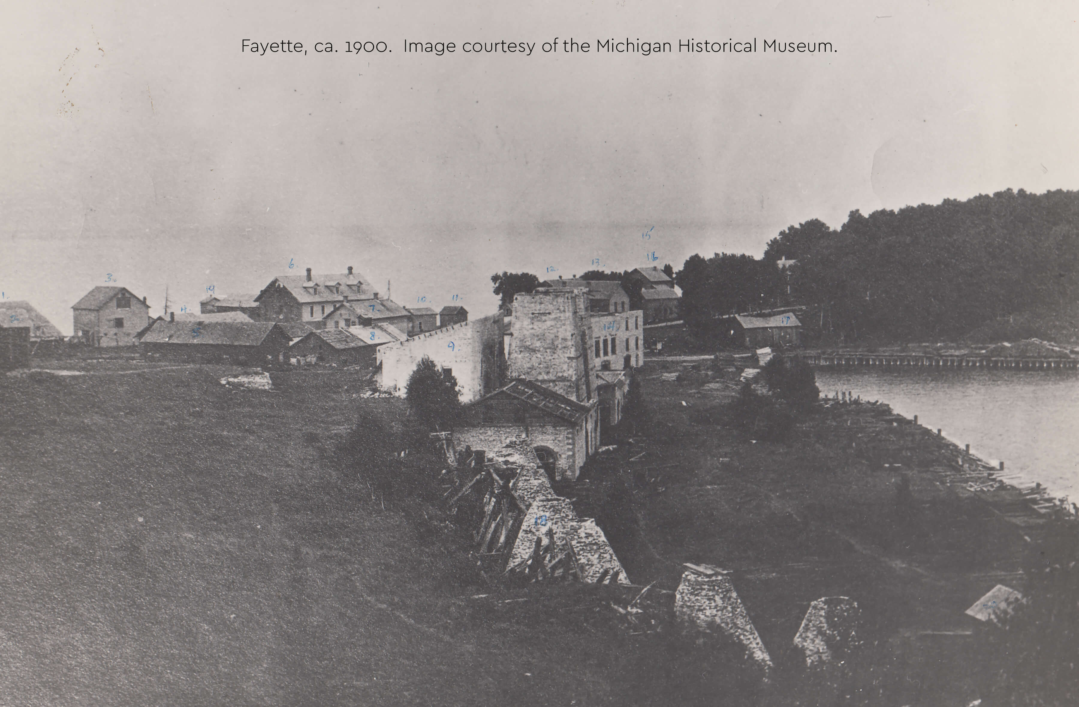 Historic view of Fayette's stone ruins, buildings, and shoreline, ca. 1900.