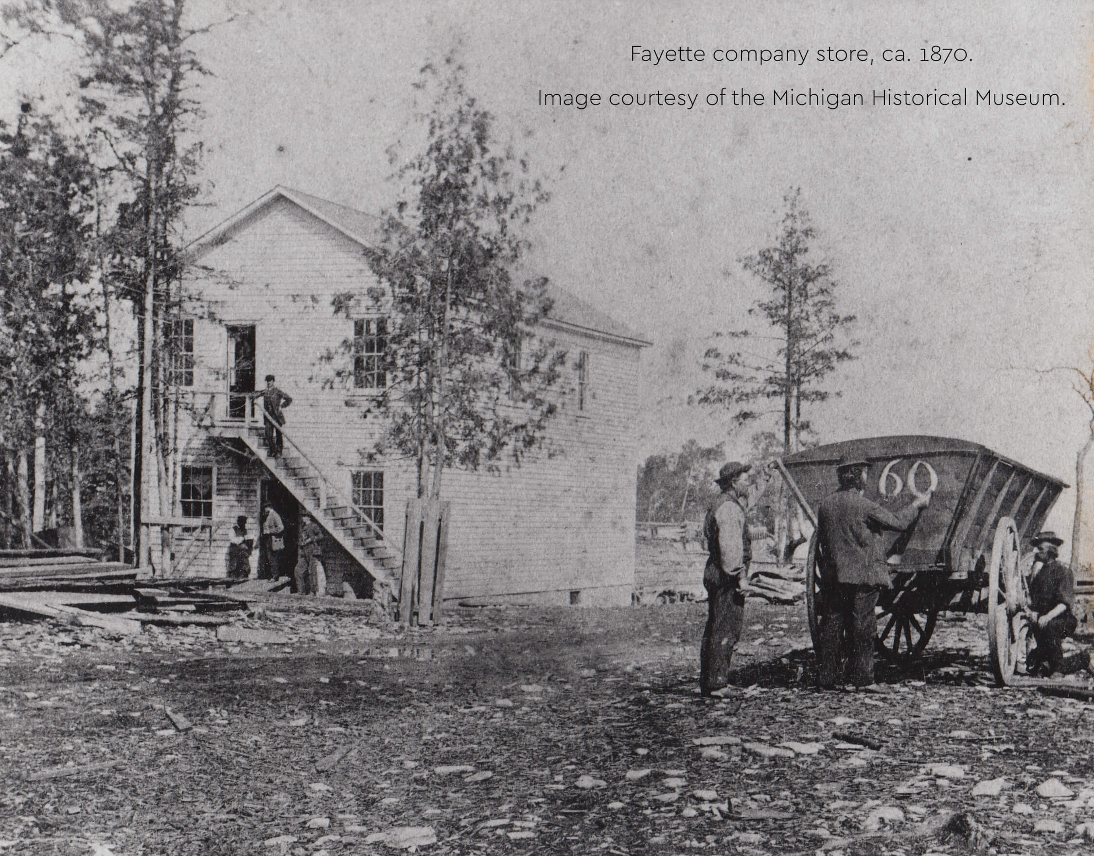 Historic photo of Fayette company store with workers and a cart, ca. 1870.