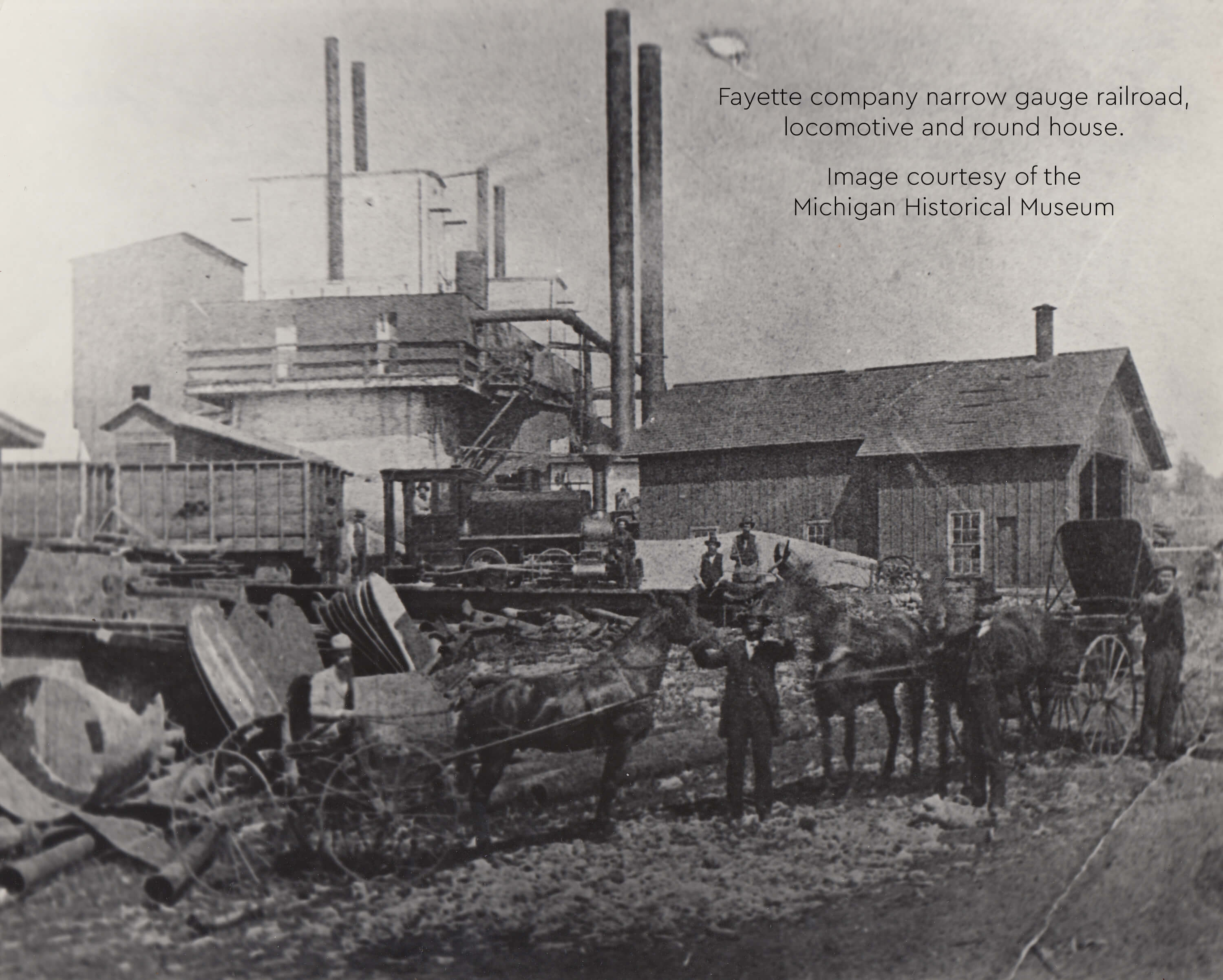 Historic photo of Fayette narrow gauge railroad with workers and horses.