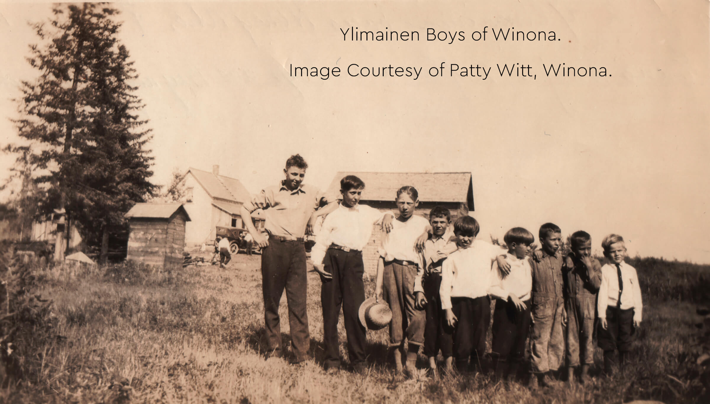 Historic photo of the Ylimainen boys of Winona standing together in a grassy field.