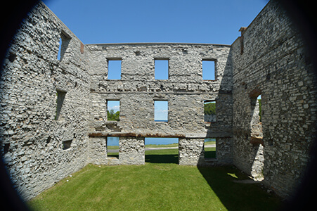 Stone walls of the Fayette furnace ruins with open window frames.