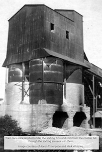 Historic photo of sorting bins and rock crusher at Fiborn Quarry.