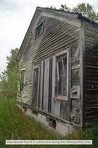 Abandoned home in Labranche along the Metropolitan Line.