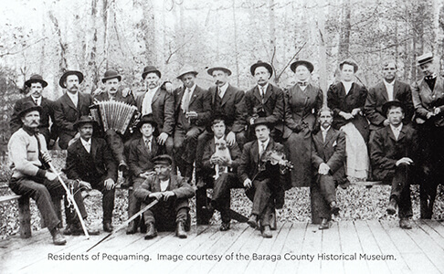 Historical photograph of Pequaming residents in formal attire
