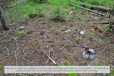 Scattered debris in Creighton, remains of a former settlement.