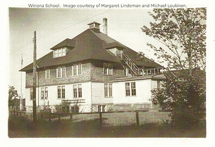 Historic photo of the Winona School, a large multi-story building with a steep roof.